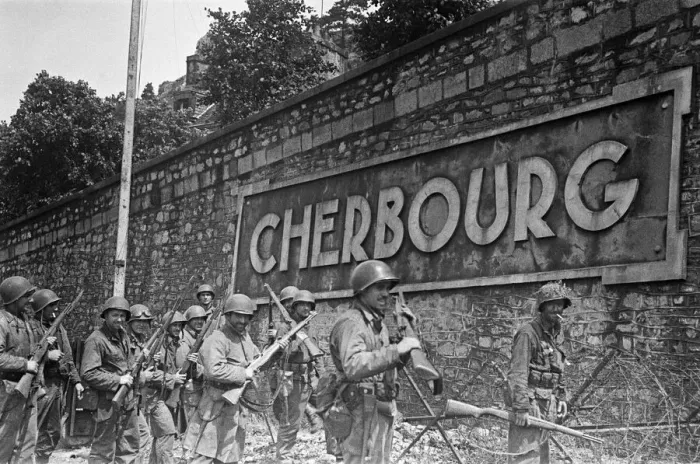 Framed Print : Soldiers of the US 79th Infantry Division seen here enter the fortified port of Cherbourg