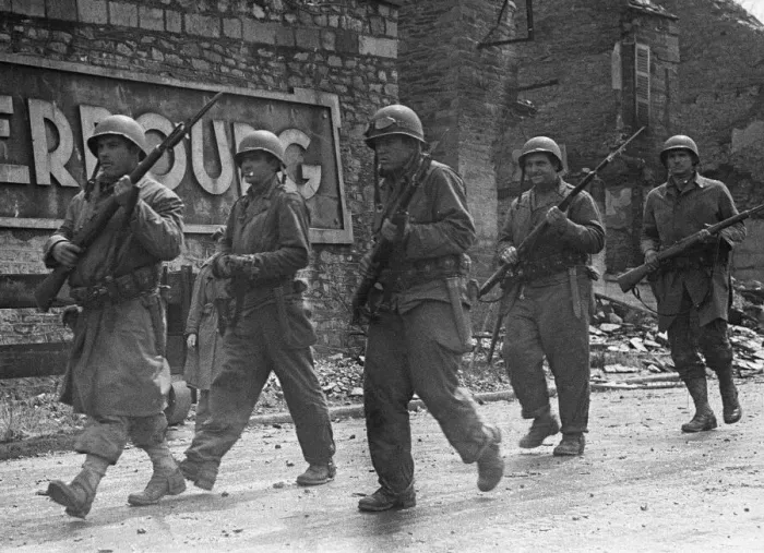 Framed Print : Soldiers of the US 79th Infantry Division seen here enter the fortified port of Cherbourg