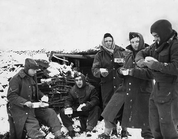 Soldiers of the British expeditionary Force have a break for refreshments in the snow