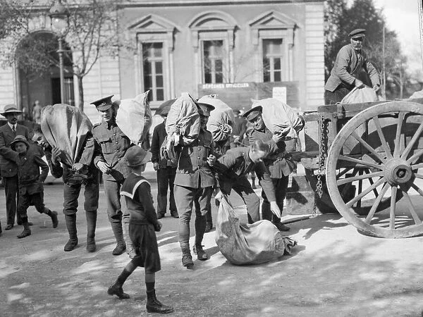 Soldiers of the British Expeditionary Force seen here loading a cart in Le Harve before