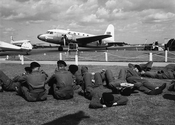 Soldiers from the Duke of Wellington Regiment waiting at Blackbushe Airport while repairs