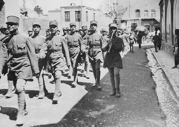 Soldiers of the Iranian infantry seen here parading through Teheran shortly after