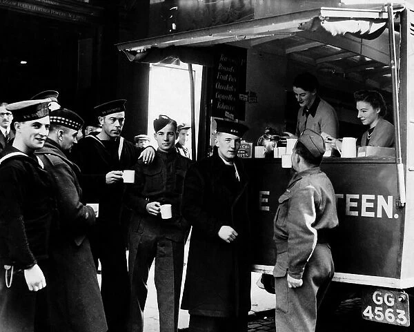 Soldiers and sailors at a mobile canteen in Glasgow during World War Two April 1940