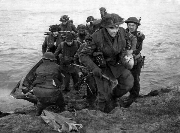 Soldiers of a Scottish infantry division of the British Army leave their assault craft