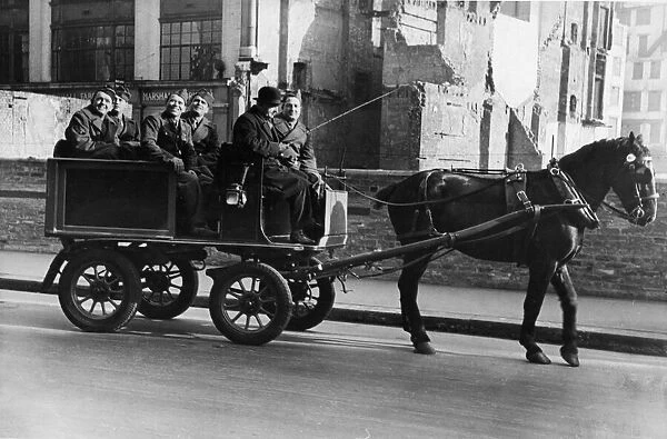 US soldiers see the sights of London from a converted milk wagon