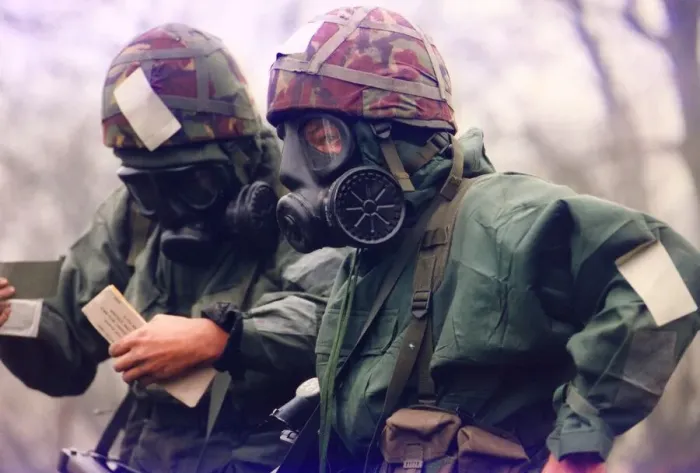 Framed Print : Soldiers from the T. A. wearing nuclear and biological suits and masks for an exercise Framed Print : Soldiers from the T. A. wearing nuclear and biological suits and masks for an exercise