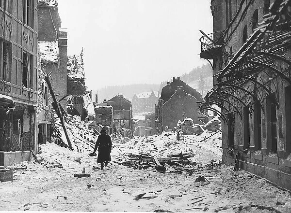 A soldiers walks through snow covered ruins of Laroche after it had been shelled by