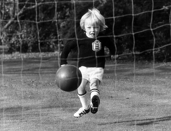 The son of England football international Raich Carter, practicing in the back garden of