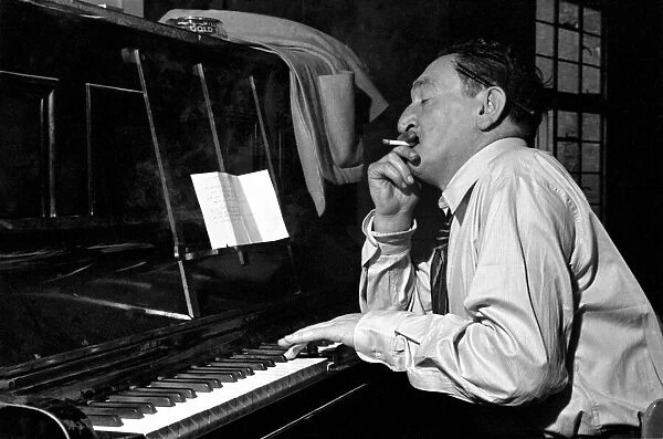 Song writer Harry Leon seen here playing piano. May 1953 D2367-002