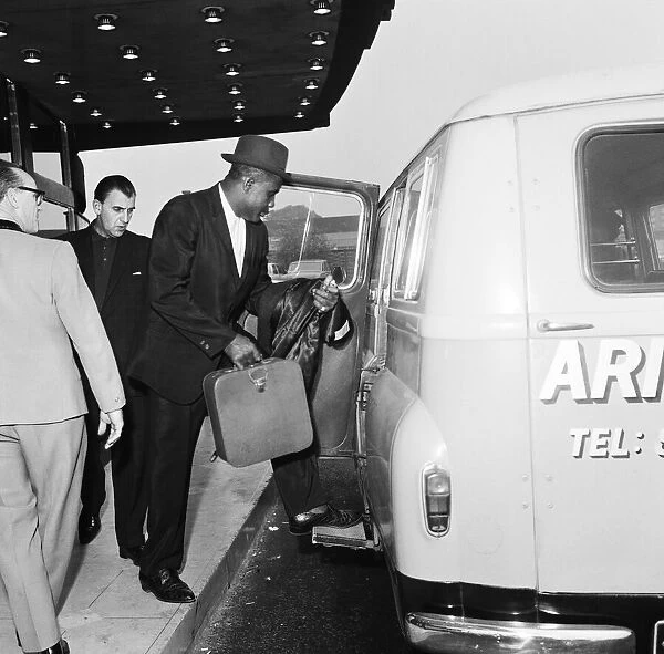 Sonny Liston, World Heavyweight Champion, pictured at London Heathrow Airport as he heads