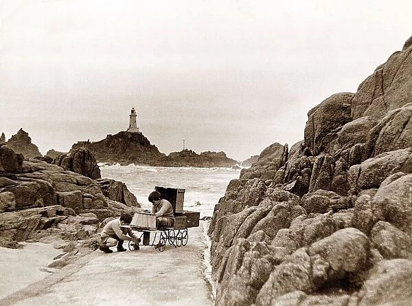 The two sons of the Corbiere Lighthouse keeper play on the causeway that leads to