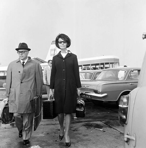 Sophia Loren arrives at London Airport after flying from Moscow where she won the Best