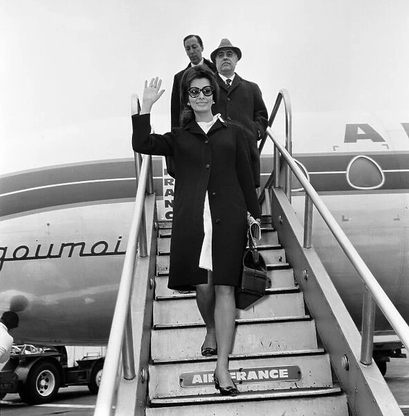 Sophia Loren and Carlo Ponti arriving at London Airport. 11th April 1966
