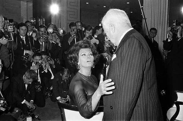 Sophia Loren and Charlie Chaplin at a press conference at the Savoy Hotel, London