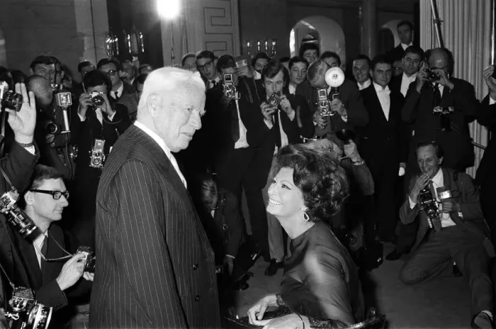 Framed Print : Sophia Loren and Charlie Chaplin at a press conference at the Savoy Hotel, London