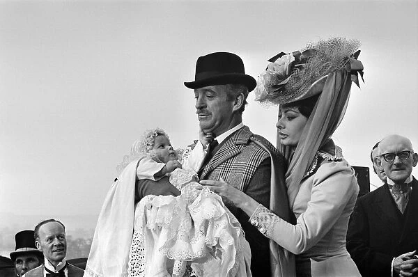 Sophia Loren and David Niven filming 'Lady L'with baby Simon, aged 9 months