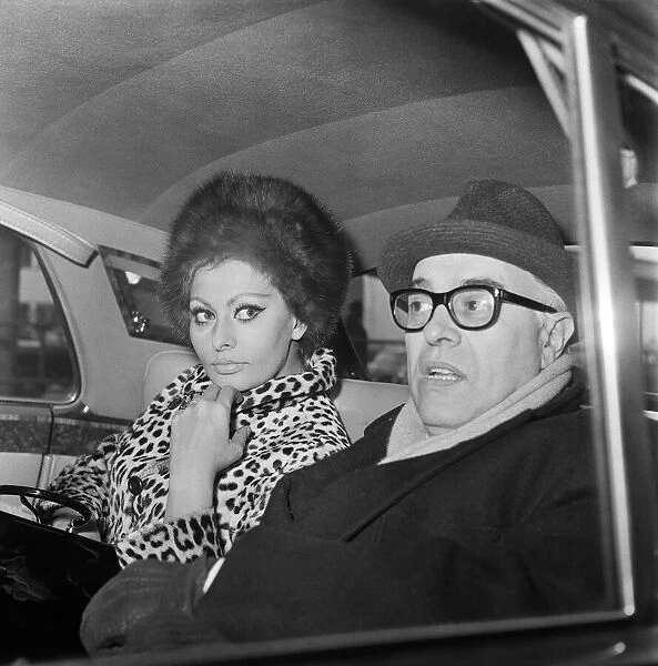 Sophia Loren and her husband Carlo Ponti arriving at London Airport. 15th January 1966