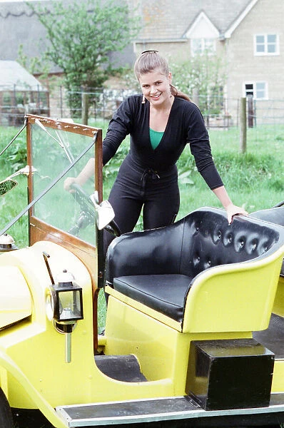 Sophie Aldred as Ace pose with the Doctors car Bessie whilst on location filming for