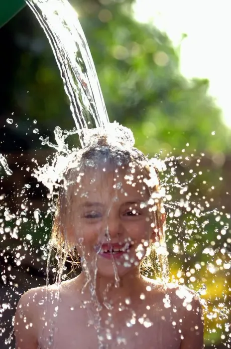Framed Print : Sophie Davies (6yrs) (daughter of photographer) cools off in the hot weather with a Framed Print : Sophie Davies (6yrs) (daughter of photographer) cools off in the hot weather with a