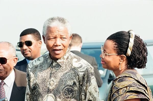 South African Preident Nelson Mandela seen here at Heathrow airport with Graca Machel