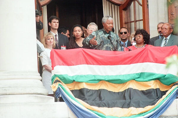 South African President Nelson Mandela addresses the crowds from the balcony of South
