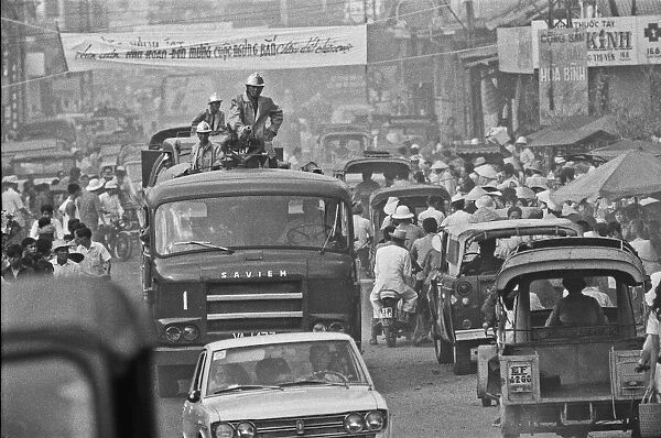 South Vietnamese fire service trying to make their way through the congested streets of