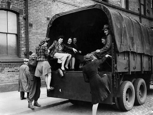 South York tram strikes. Girl munition workers being helped into an army lorry