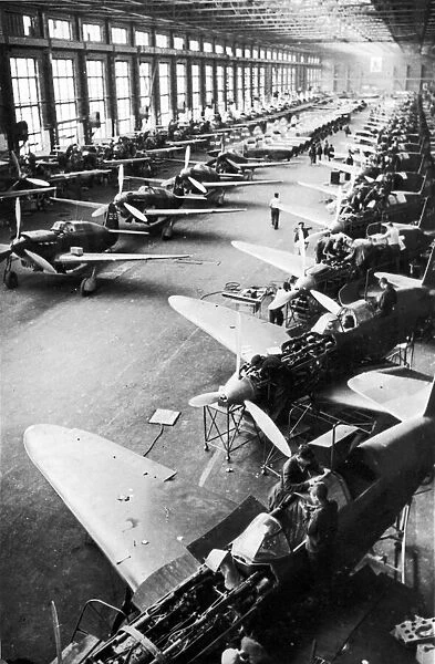 Soviet Yak fighter planes on the assembly line at a factory in Russia during the Second