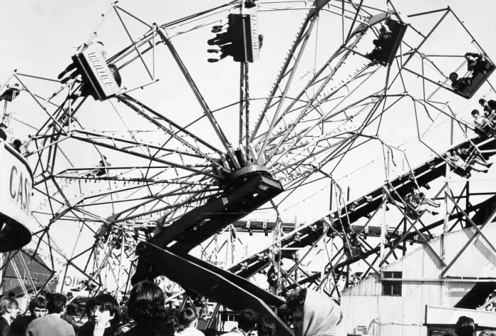 Framed Print : The Spanish City amusement park in Whitley Bay - holidaymakers enjoy a spin on one of Framed Print : The Spanish City amusement park in Whitley Bay - holidaymakers enjoy a spin on one of