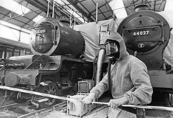 Specialist removing blue asbestos from two vintage steam train - Midland Railway Trust at
