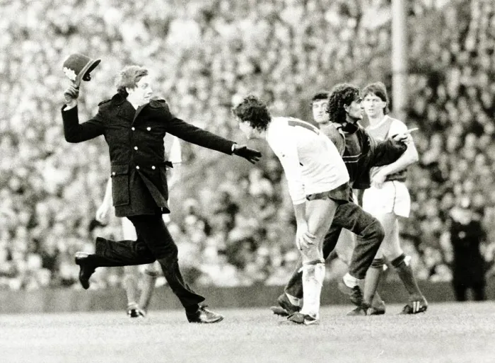 Framed Print : Spectator runs onto football pitch chased by policeman Arsenal v Tottenham