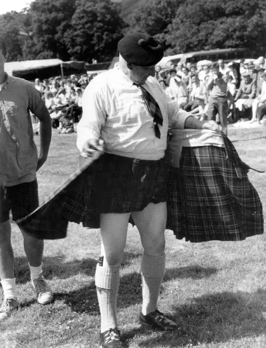 Framed Print : Spectators a Luss Highland Gathering cheered as 71-year-old games president Bob Kerr