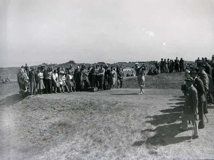Framed Print : Spectatotrs watch a competitor tee off during the 1949 British Open at Royal St