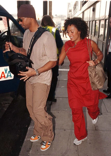 Spice Girl Mel B and husband Jimmy Gulzar Sep 1998 Newly weds leaving Heathrow for