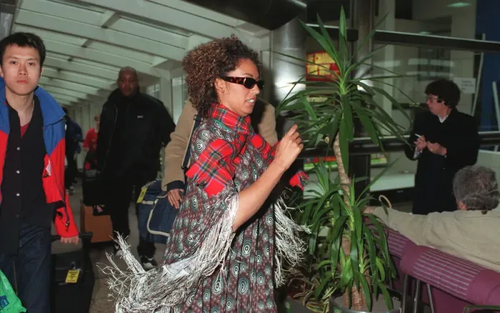 Framed Print : Spice Girls Mel B wearing a tartan scarf and sunglasses April 1998 Framed Print : Spice Girls Mel B wearing a tartan scarf and sunglasses April 1998