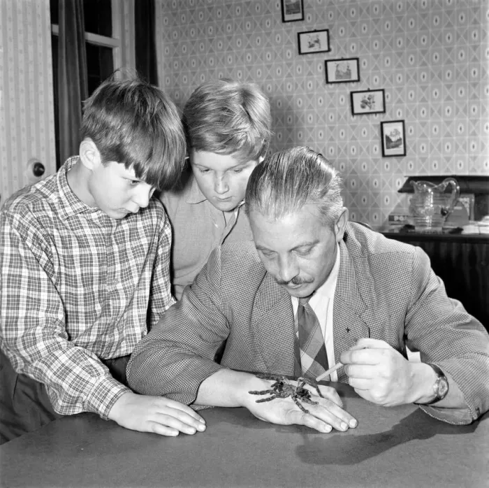 Framed Print : Spider collector Mr. S. Ormorod seen here showing the children two of his collection