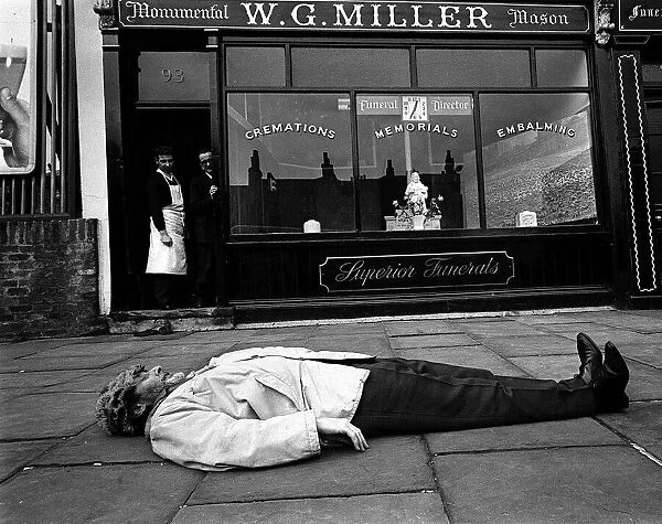Spike Milligan comedian and author March 1963 prostrate on the pavement in front