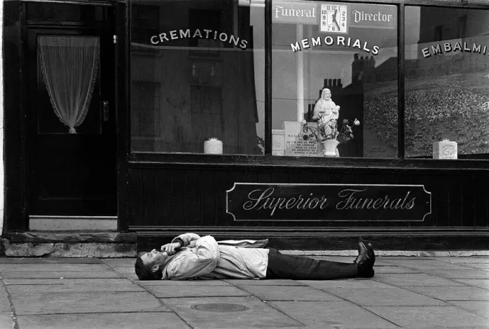Framed Print : Spike Milligan comedian March 1963 prostate outside an Islington undertakers Framed Print : Spike Milligan comedian March 1963 prostate outside an Islington undertakers