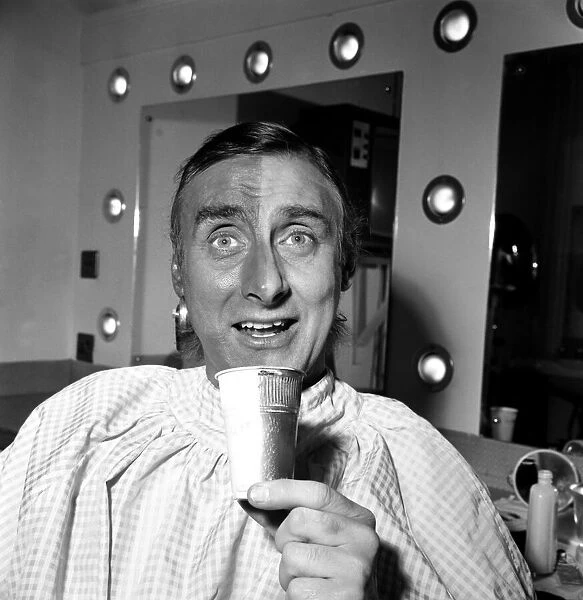 Spike Milligan making up for his part in his new TV series as a Pakistani