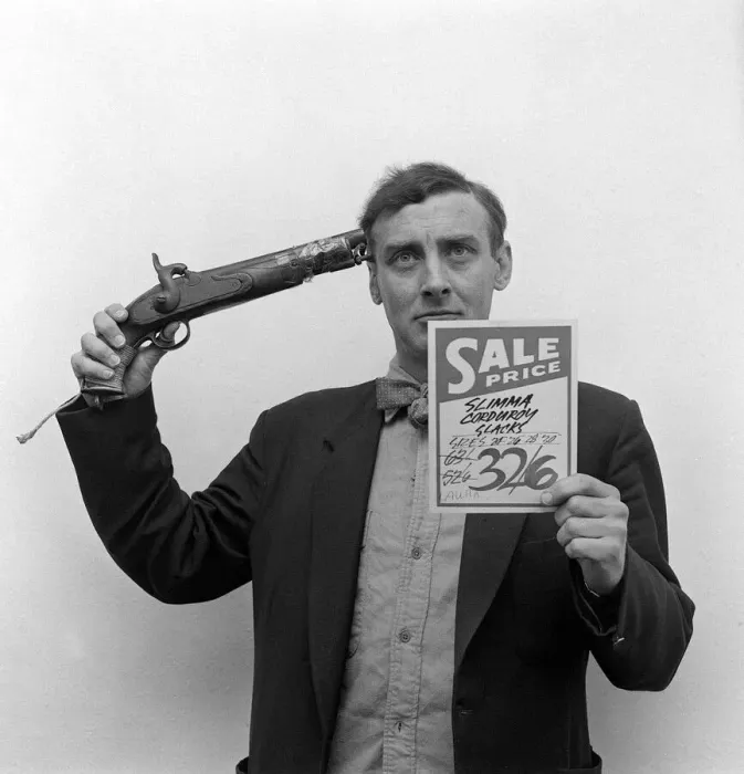 Framed Print : Spike Milligan poses for a set of pictures that represent famous film titles April Framed Print : Spike Milligan poses for a set of pictures that represent famous film titles April