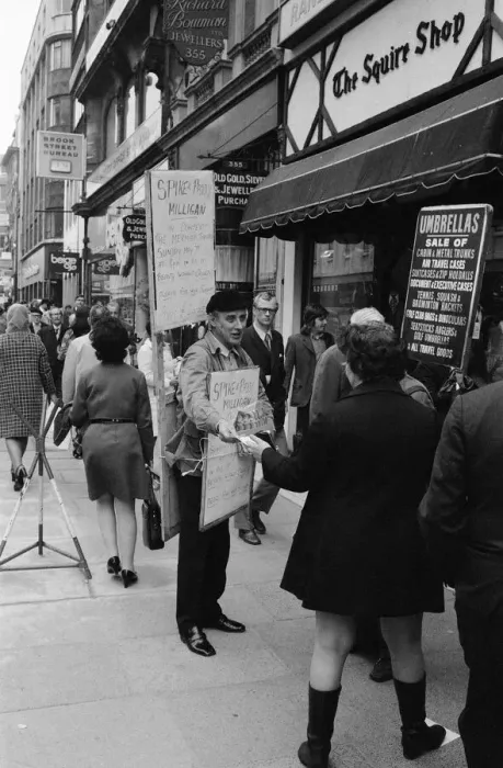 Framed Print : Spike Milligan & wife Paddy use a Sandwich board - borrowed from British Rail Lost
