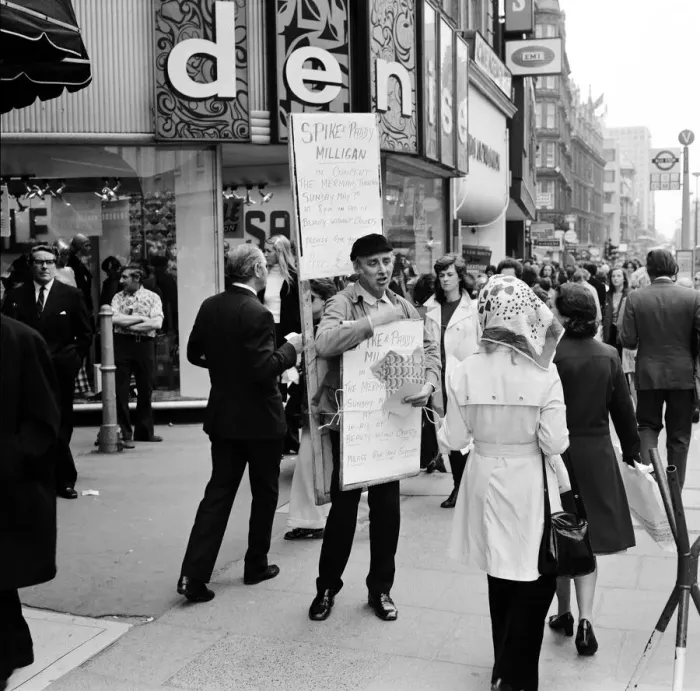 Framed Print : Spike Milligan & wife Paddy use a Sandwich board - borrowed from British Rail Lost
