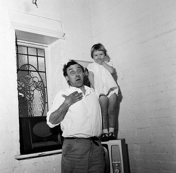 Spike Milligan with his three year old daughter Sile Milligan, pulling funny faces
