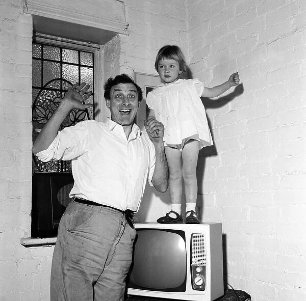 Spike Milligan with his three year old daughter Sile Milligan. 16th June 1961
