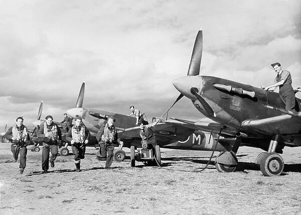 Spitfire fighter planes and men of the Bombay Squadron who have taken part in fighter