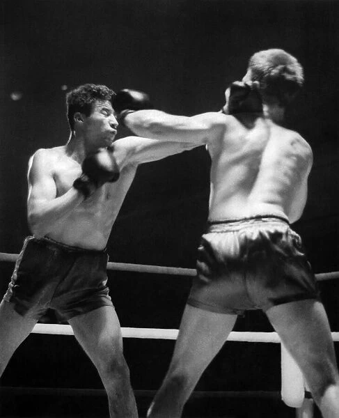 Sport Boxing: Willie Fisher right land a left high on the head of Alf Matthews (left