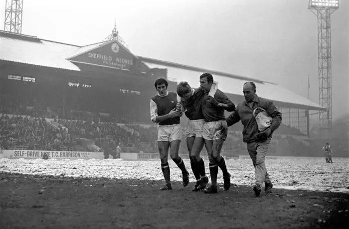 Framed Print : Sport: Football: Sheffield Wednesday v. Arsenal. Whitham helped by Arsenal players Framed Print : Sport: Football: Sheffield Wednesday v. Arsenal. Whitham helped by Arsenal players