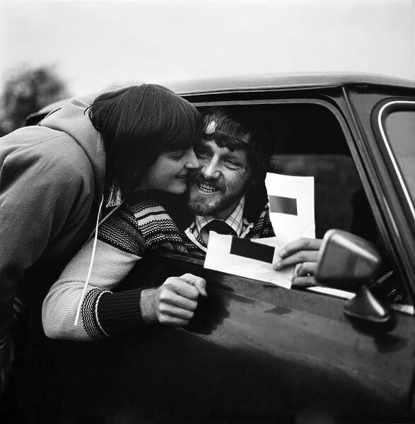 Sport: Footballer: Peter Cook holds up his L plates after passing his driving test