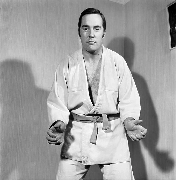 Sport Judo: Man posing wearing his judo pit. November 1969 Z10935-009