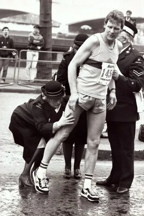 Framed Print : Sport - London Marathon An athlete recieves attention from medics after receiving Framed Print : Sport - London Marathon An athlete recieves attention from medics after receiving
